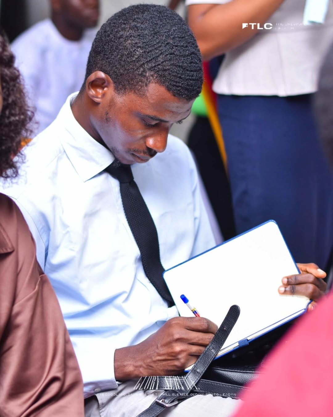 A church member taking notes during a service